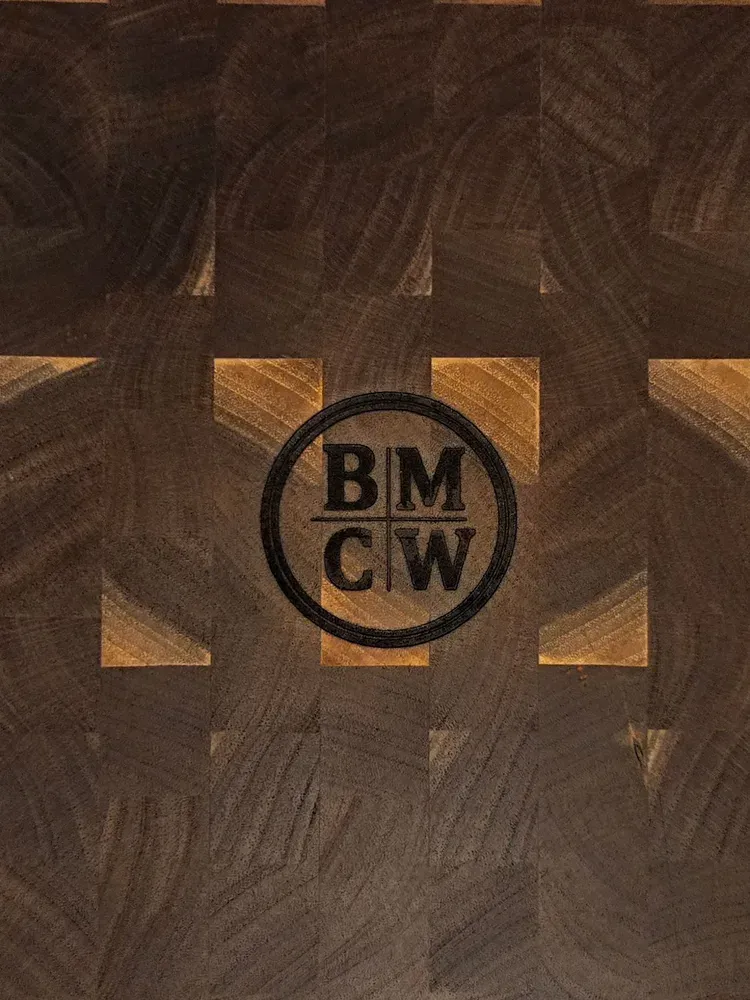 The BMCW monogram branded into an end grain walnut butcher block
